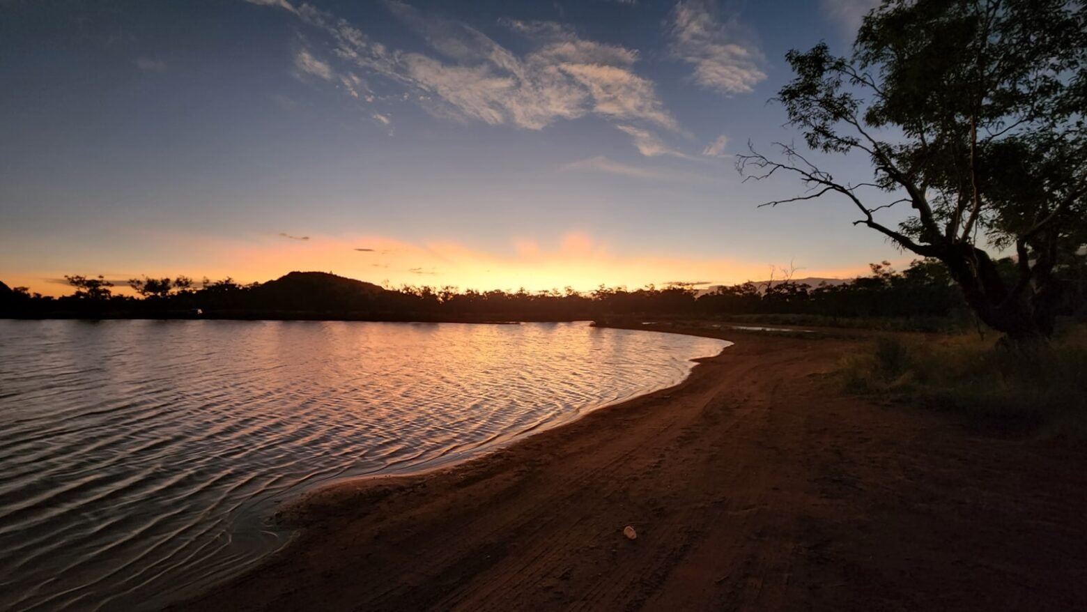 Sunset over a waterhole in the Northern Territory outback