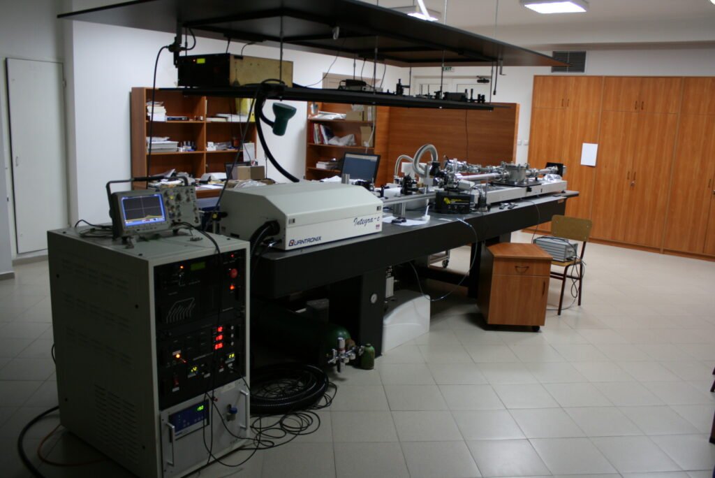 Laser system with amplifier and embedded control hardware on an optical bench