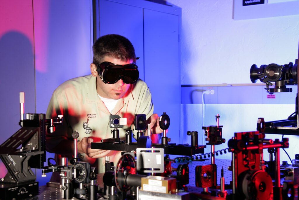 Embedded software engineer working with laser optics in a deep tech laboratory in Sydney
