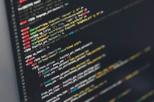 Monitor showing program code for software engineering recruitment Sydney