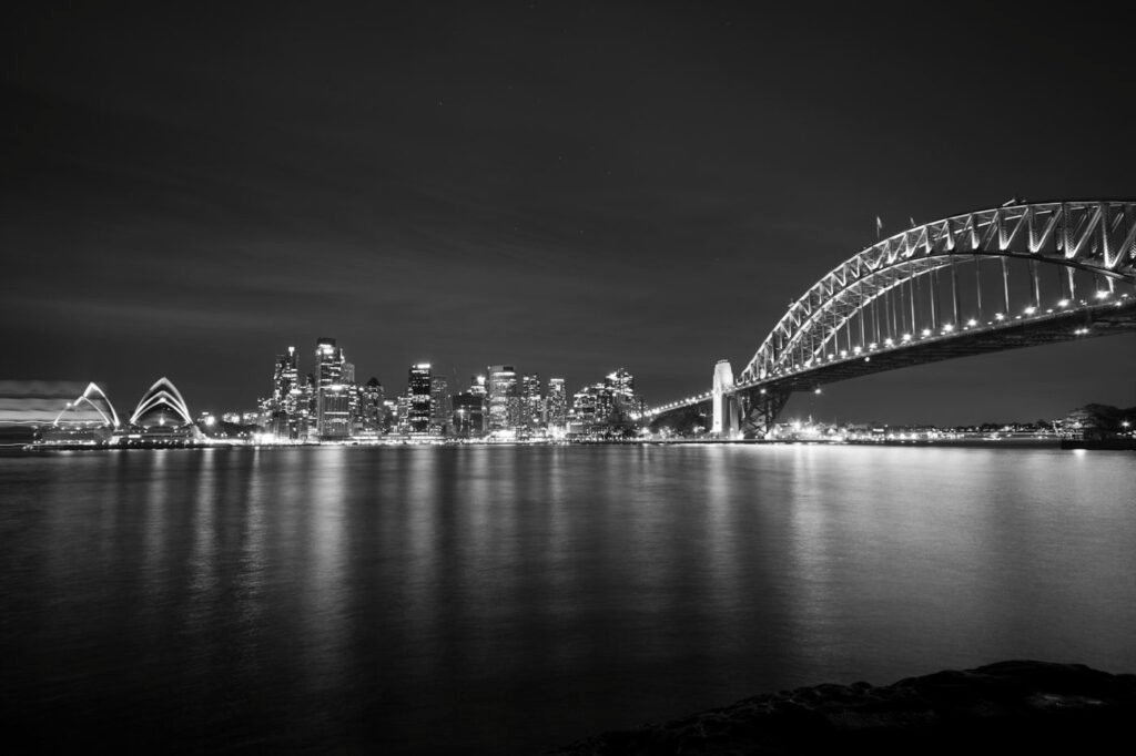 Black and white panorama of Sydney Harbour, illustrating the technical hiring market