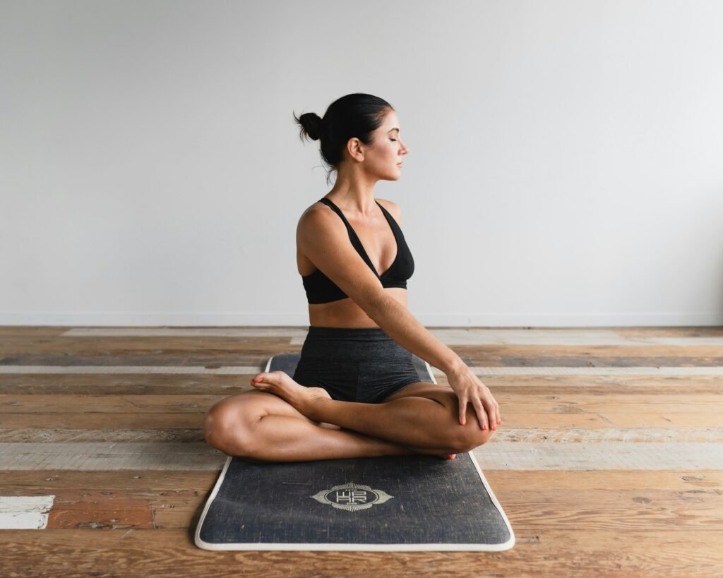 Woman stretching on a yoga mat – Senior Account Manager wellness agency job Sydney